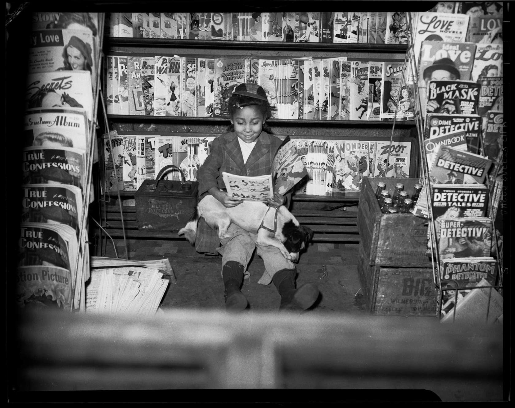 Charles “Teenie” Harris photograph of girl reading comic book.